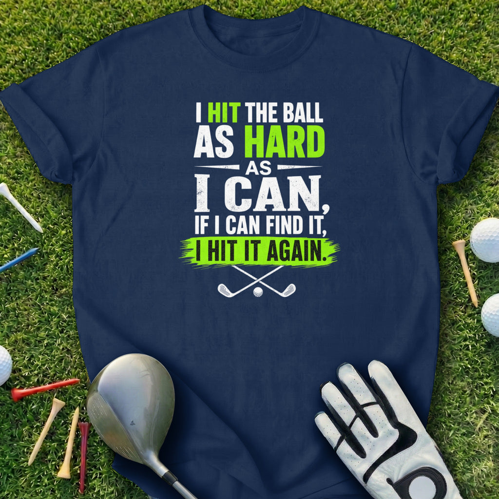 Navy t-shirt with white and green text about hitting a golf ball.