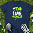 Navy t-shirt with white and green text about hitting a golf ball.