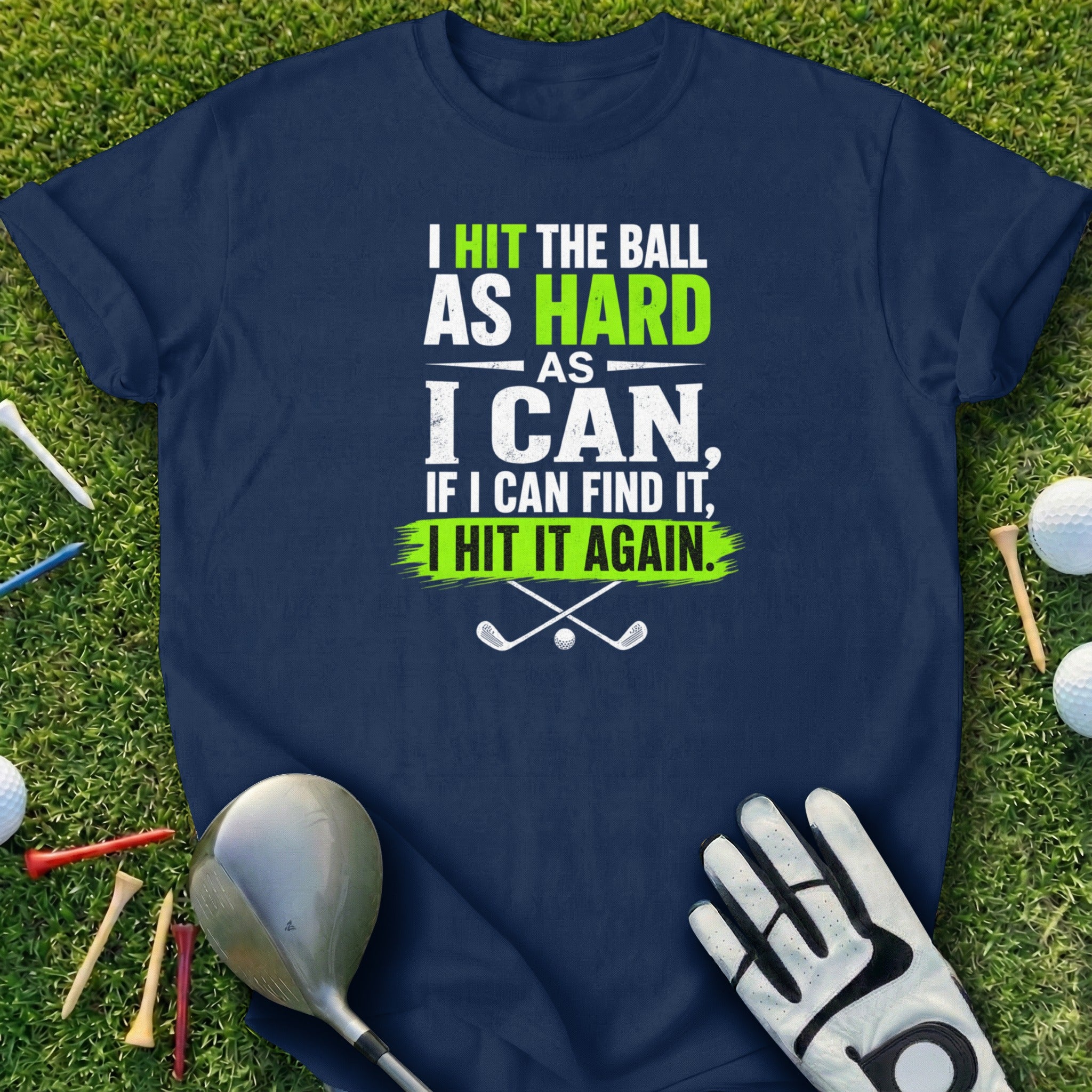 Navy t-shirt with white and green text about hitting a golf ball.