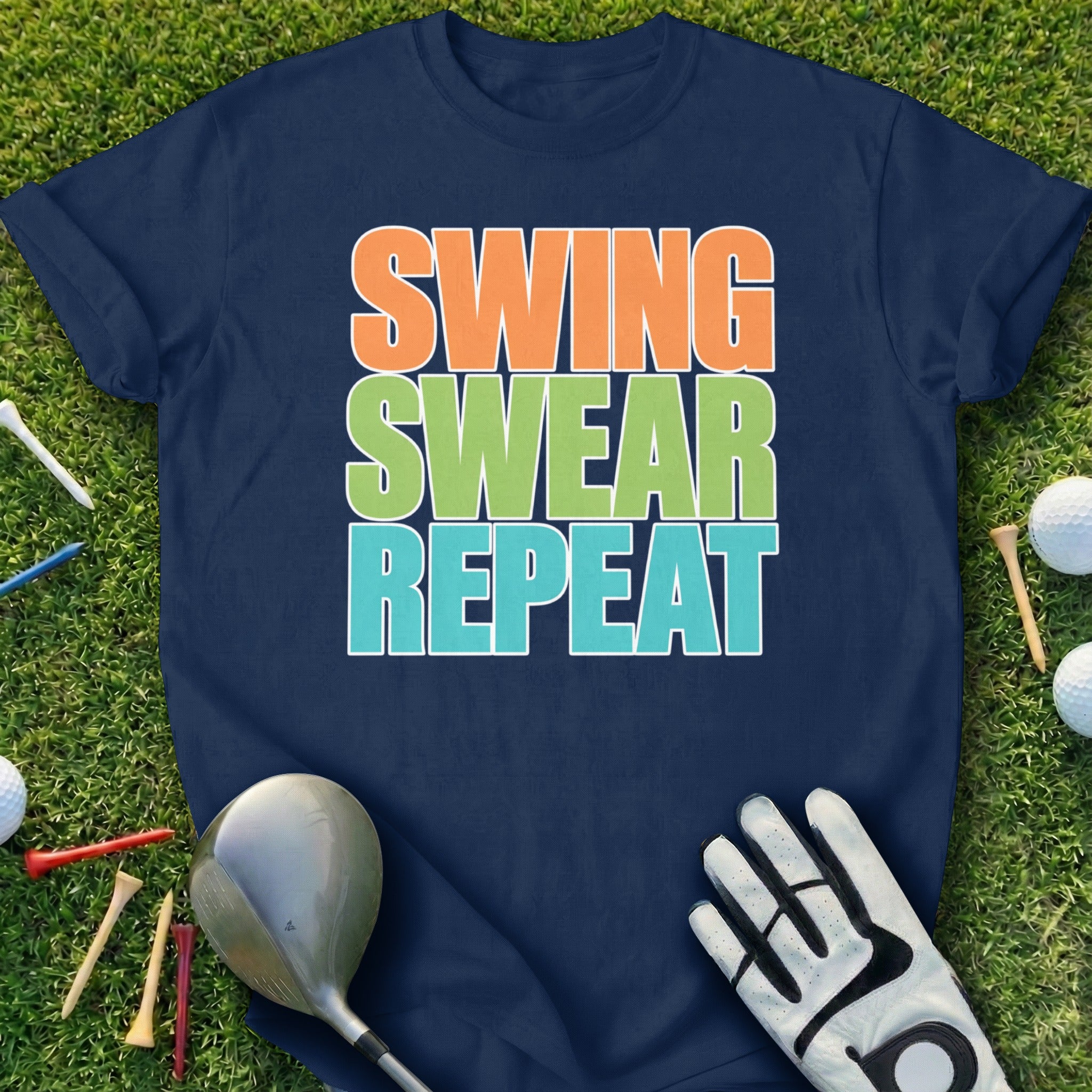 Navy t-shirt with "Swing Swear Repeat" text on a golf course background.
