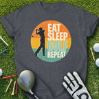 T-shirt with "Eat Sleep Golf Repeat" in a circular graphic, golf club, glove, and balls.