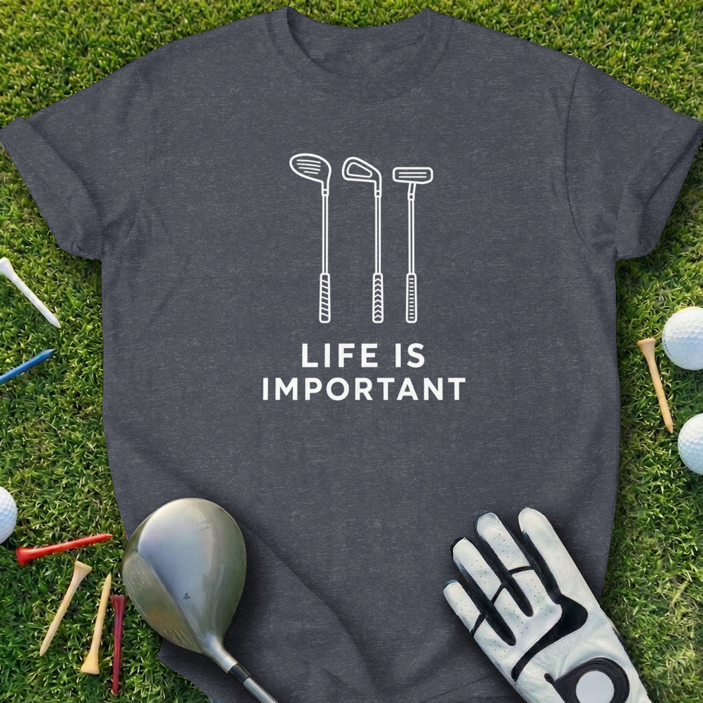 Dark gray t-shirt with white golf club icons and "LIFE IS IMPORTANT" text.
