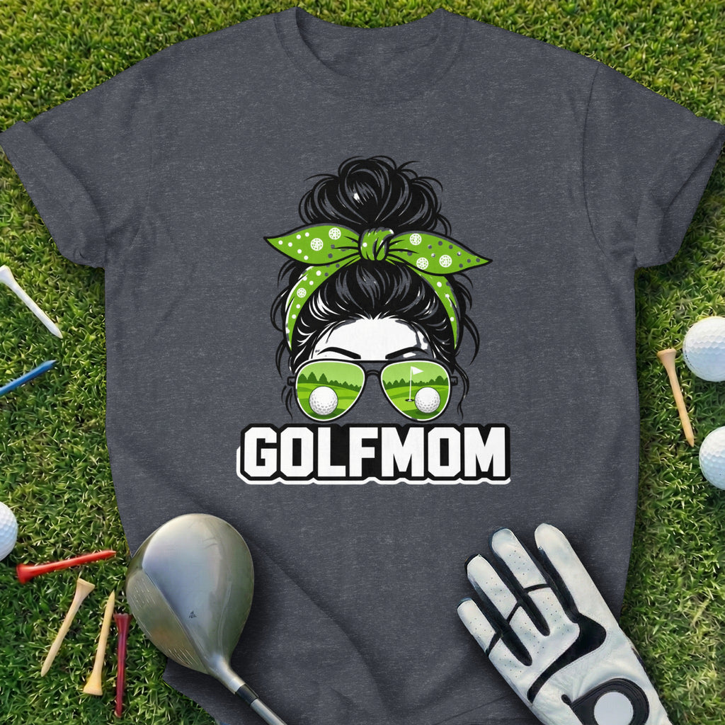 T-shirt with "GOLFMOM" text, sunglasses reflecting golf courses, and a messy bun.