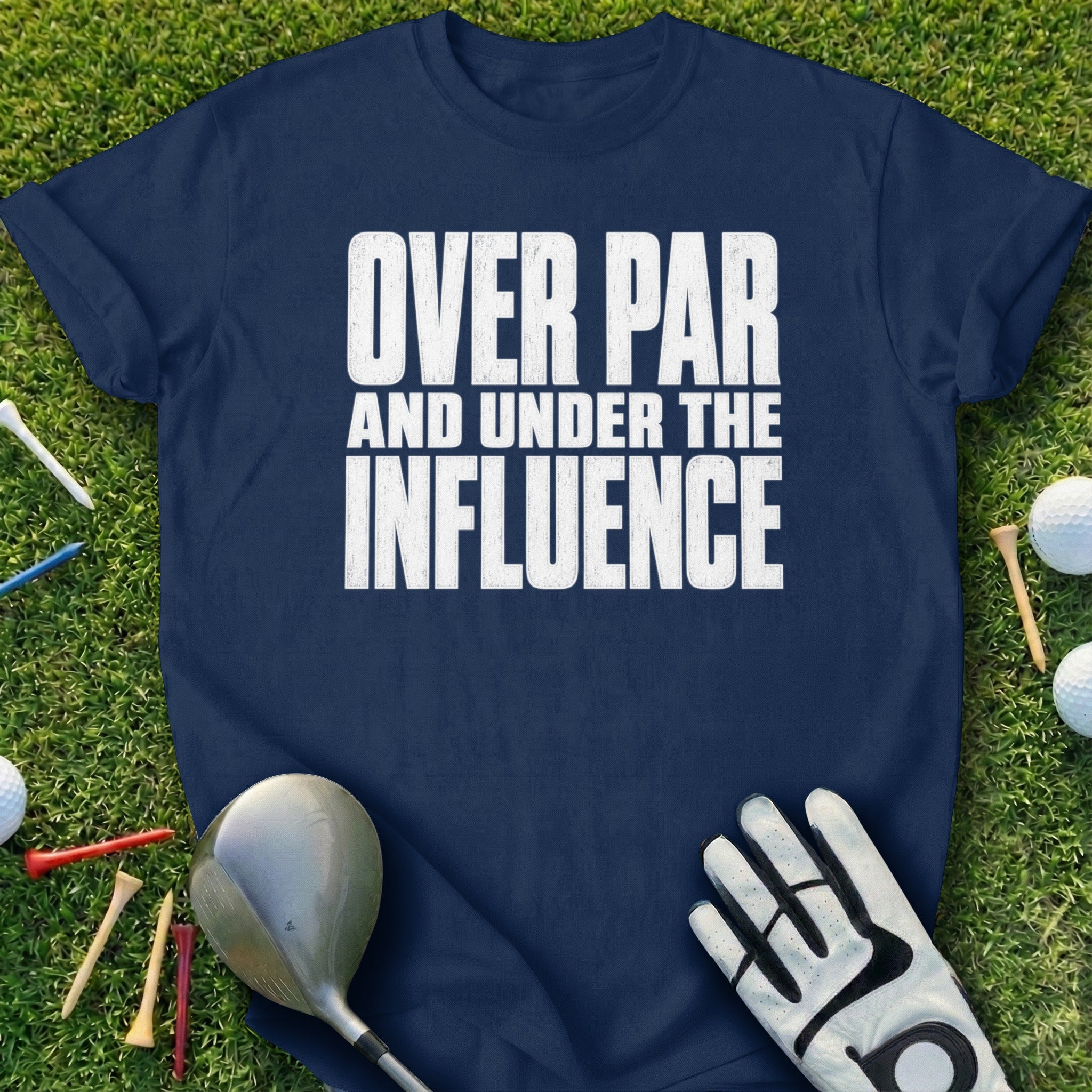 Navy t-shirt with "OVER PAR AND UNDER THE INFLUENCE" text, golf club, tees, and ball.