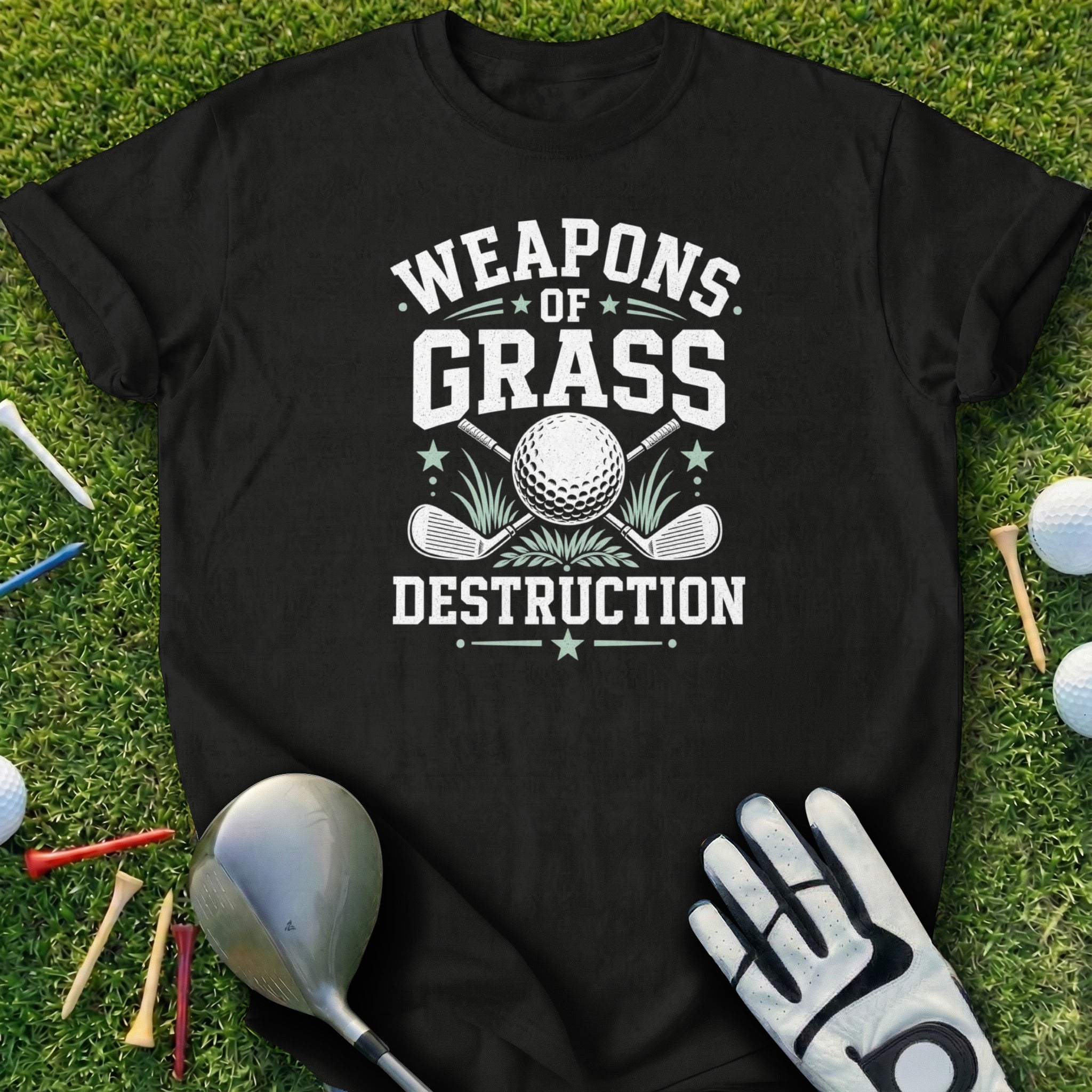 Black t-shirt with "Weapons of Grass Destruction" and golf graphics.
