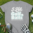 Gray t-shirt with "I Hit Golf Balls" text and golf accessories.