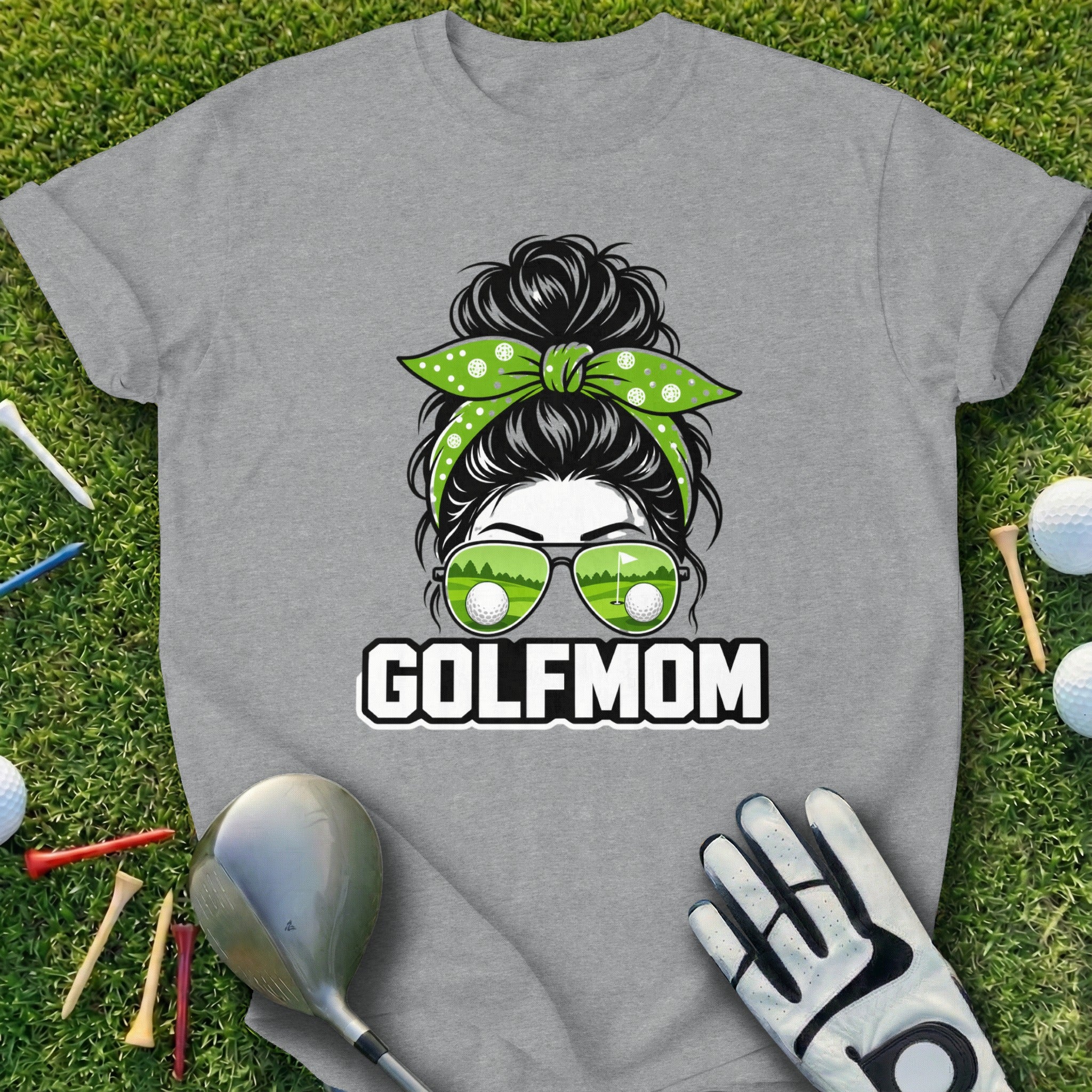 Gray t-shirt with "GOLF MOM" text and golfer's messy bun with sunglasses.