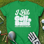Green t-shirt with "I Hit Golf Balls" text and golf equipment.