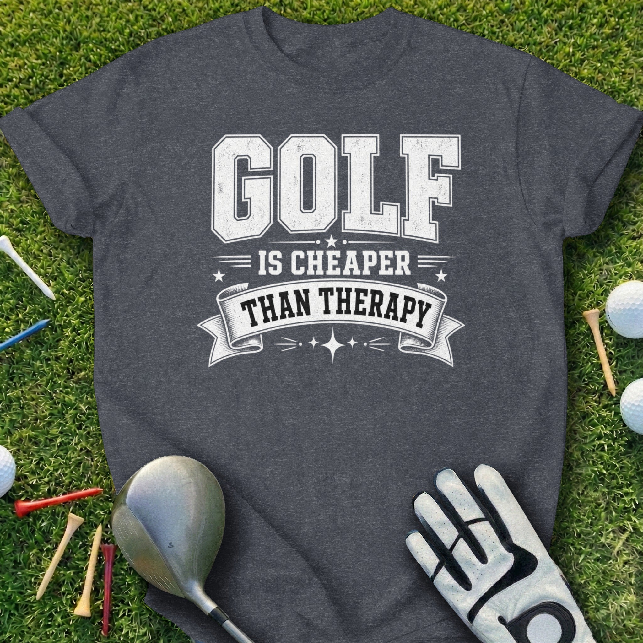Charcoal t-shirt with "GOLF IS CHEAPER THAN THERAPY" text and golf accessories.