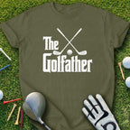 Olive green t-shirt with "The Golfather" text and crossed golf clubs.