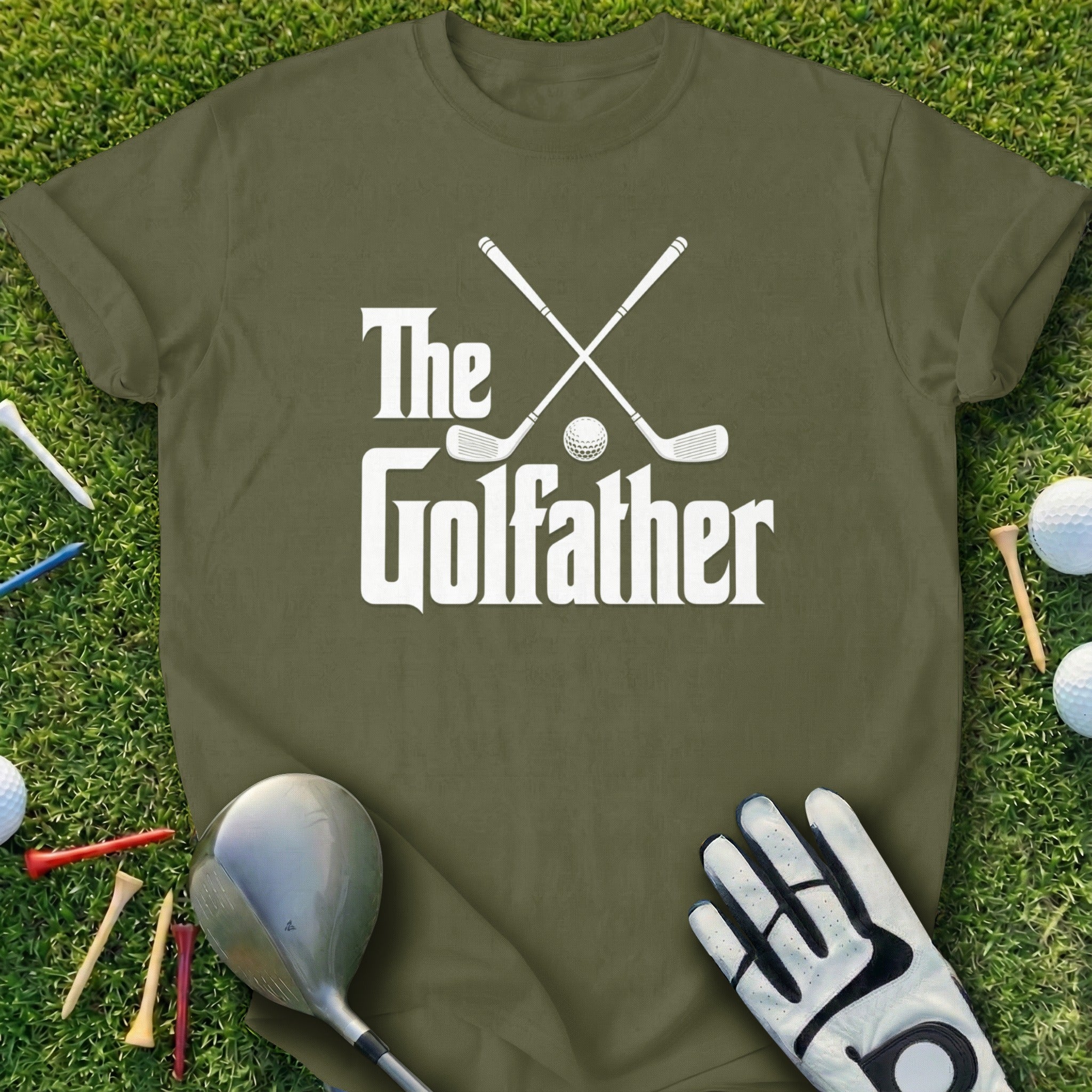 Olive green t-shirt with "The Golfather" text and crossed golf clubs.