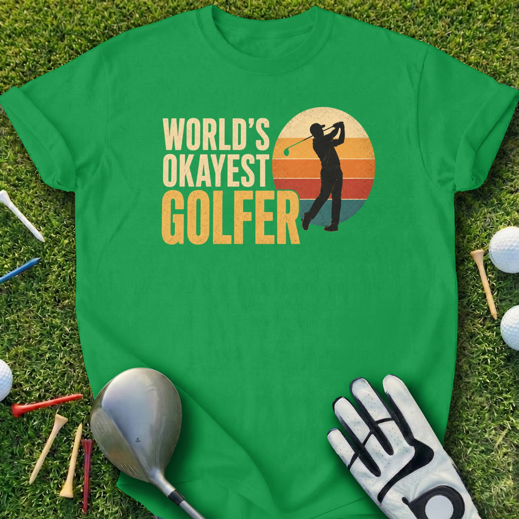 Green t-shirt with "WORLD'S OKAYEST GOLFER" and a sunset golf silhouette.