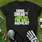 Black t-shirt with "Swing, Swear, Look for the Ball, Repeat" in white and green.