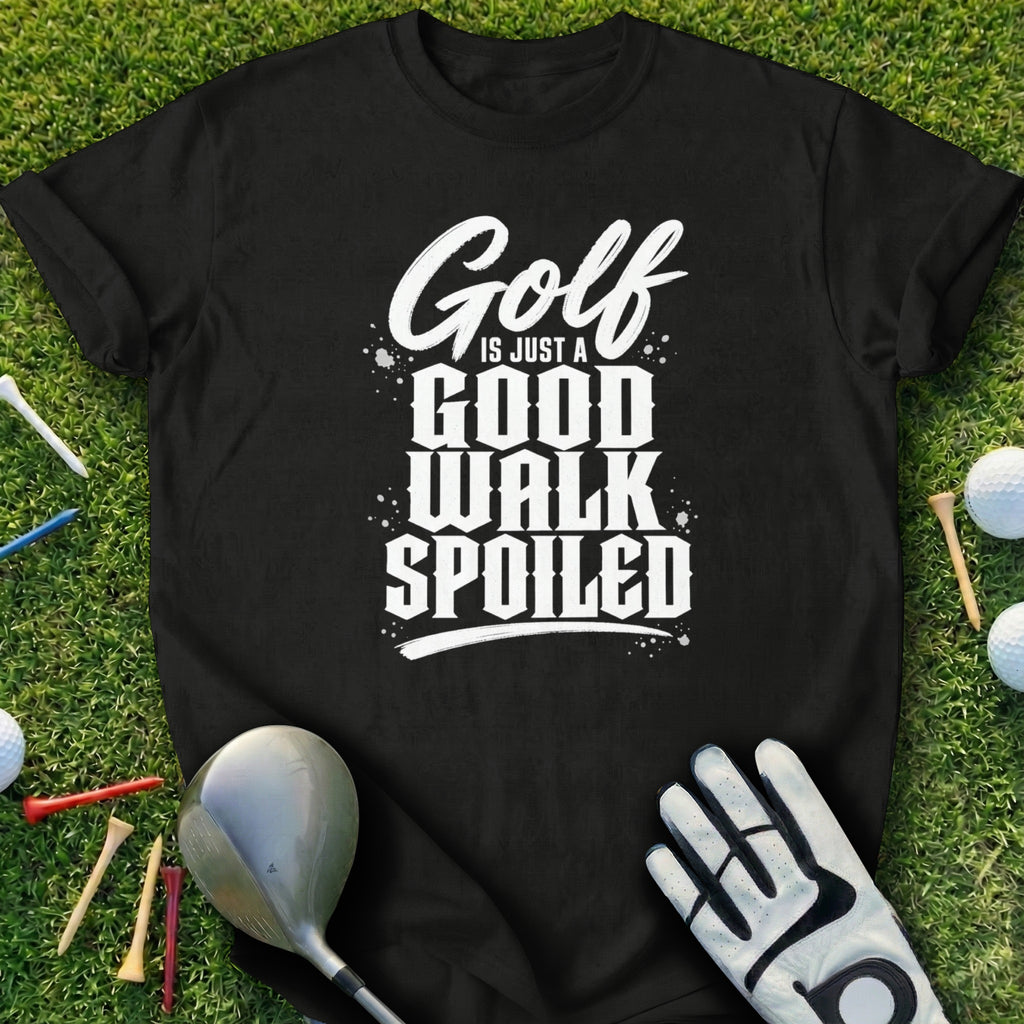 Black t-shirt with "Golf is just a good walk spoiled" text on a grass background.
