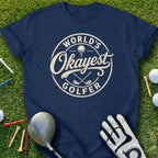 Navy t-shirt with "World's Okayest Golfer" text and golf accessories.