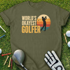 Olive green t-shirt with "World's Okayest Golfer" text and golfer silhouette.