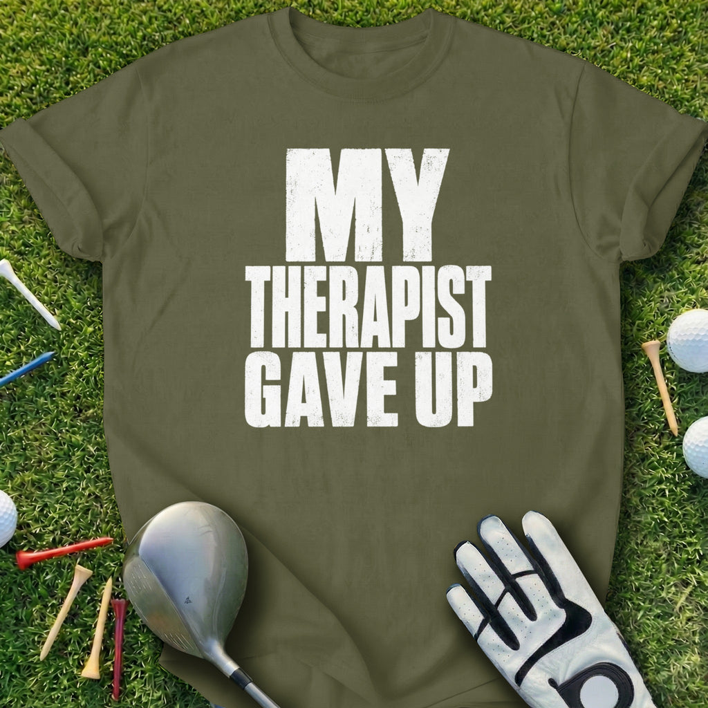 Olive green t-shirt with white text "MY THERAPIST GAVE UP".