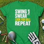 Green t-shirt with "Swing Swear Look For Ball Repeat" text and golf imagery.