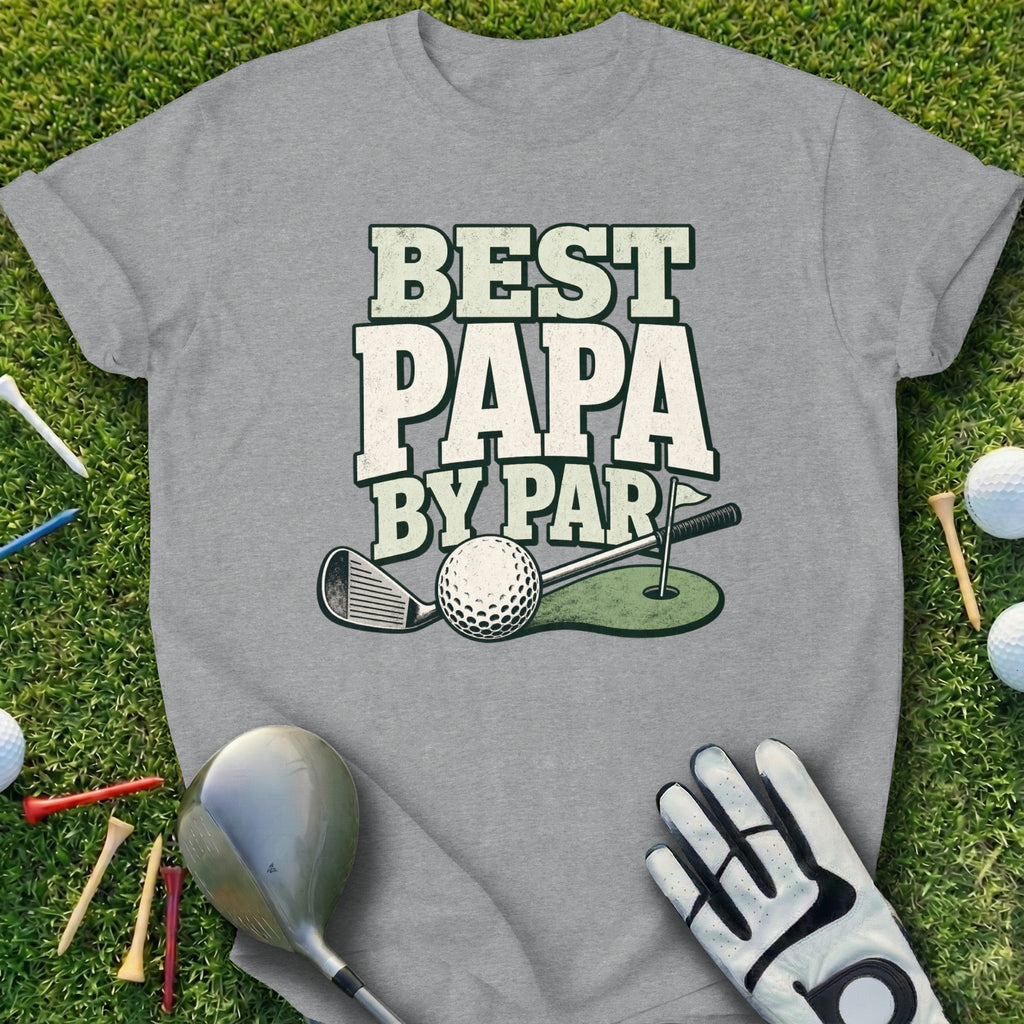 T-shirt with "Best Papa By Par" text, golf club, ball, and glove on grass.