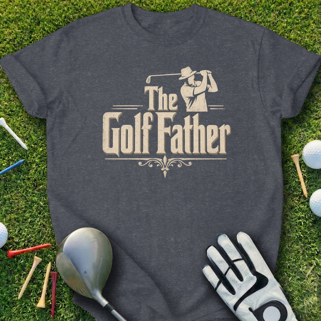Dark grey t-shirt with "The Golf Father" text and golf accessories on grass.