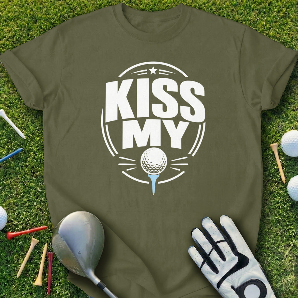 Olive green t-shirt with "KISS MY" golf ball design on grass with clubs and tees.