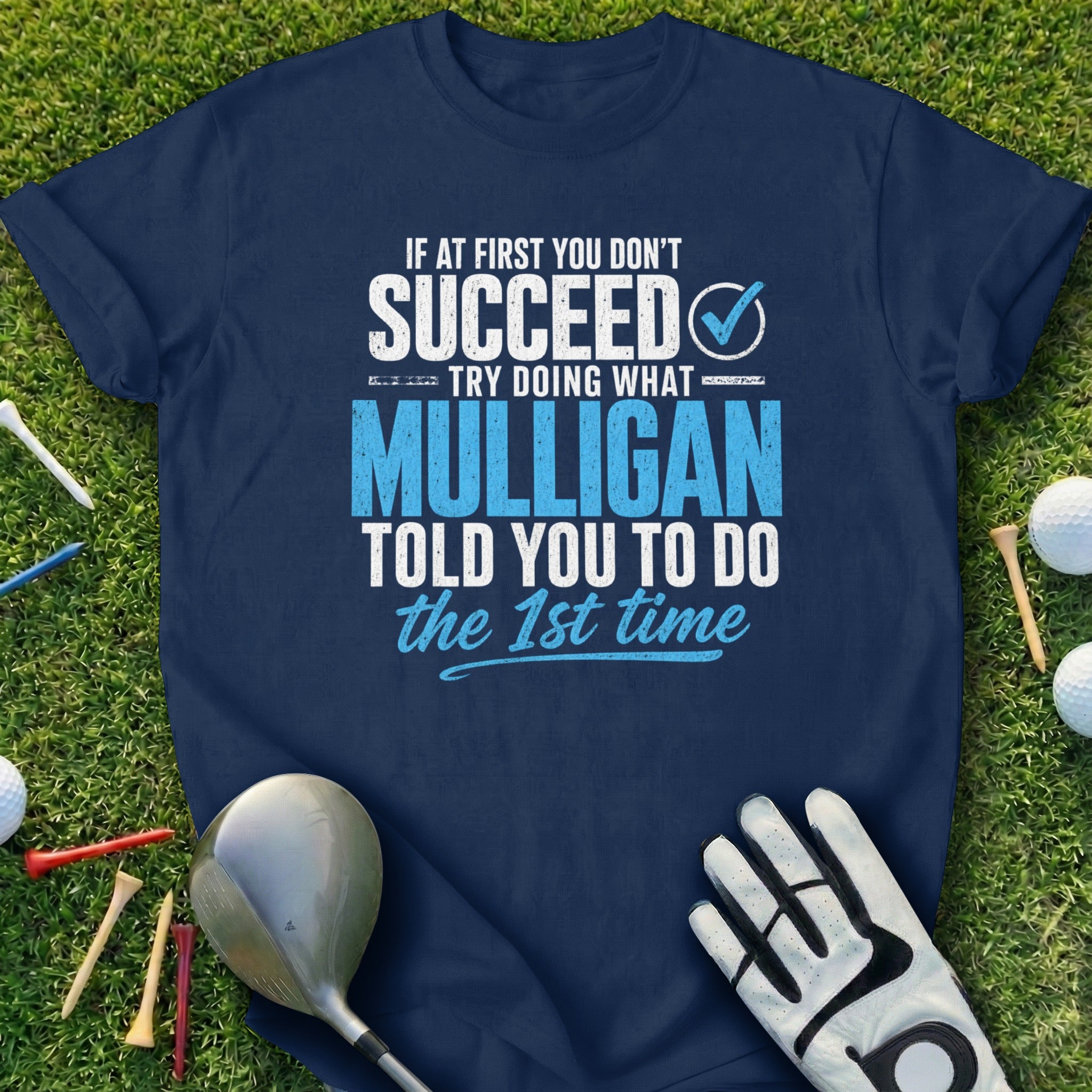 Navy t-shirt with white text about succeeding on the first try with Mulligan.