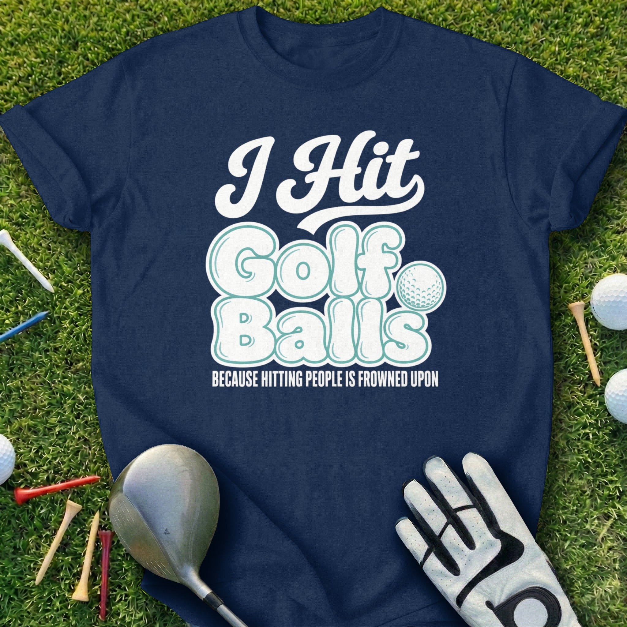 Navy t-shirt with "I Hit Golf Balls Because Hitting People Is Frowned Upon" text.