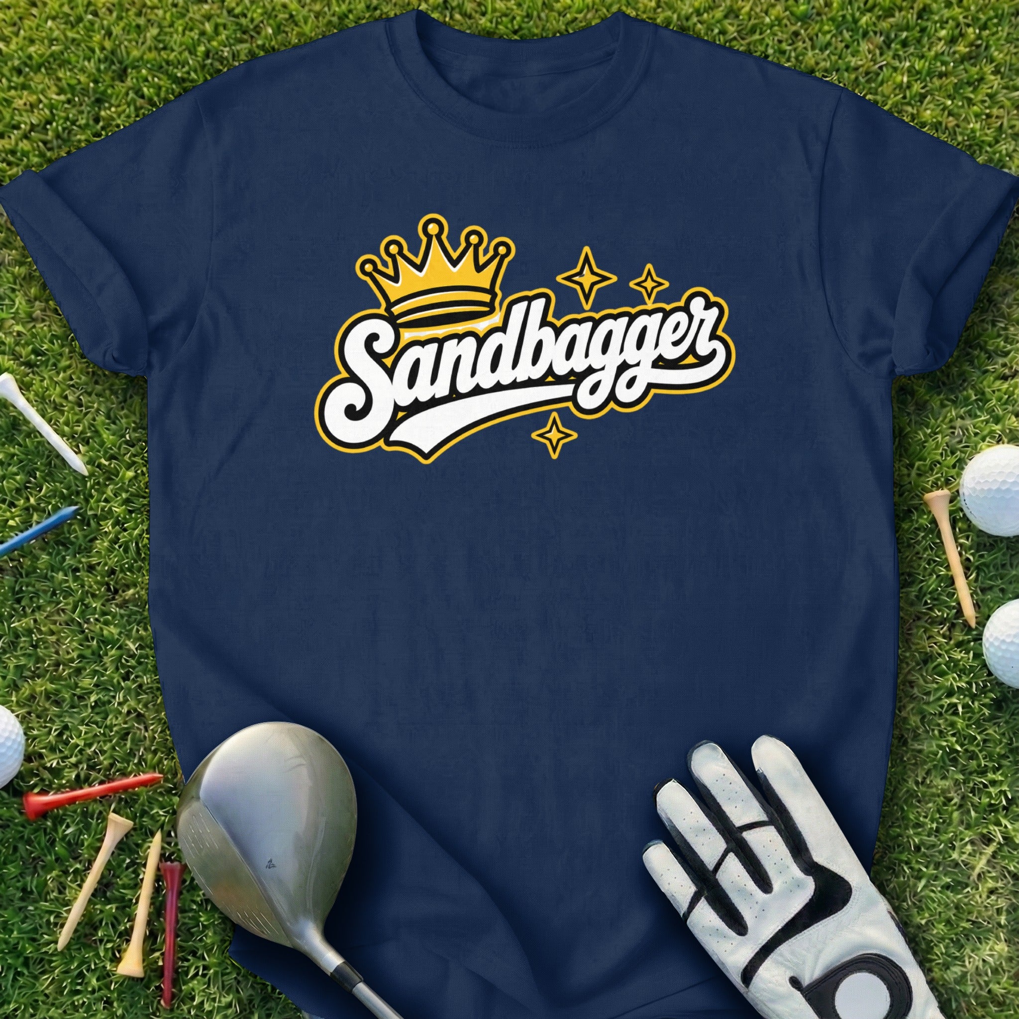 Navy t-shirt with "Sandbagger" crown logo, golf glove, and clubs.