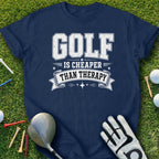 Navy t-shirt with "Golf Is Cheaper Than Therapy" text, golf clubs, tees, and balls.