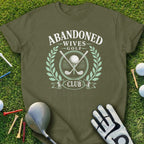 Olive green t-shirt with "Abandoned Wives Golf Club" text and golf imagery.