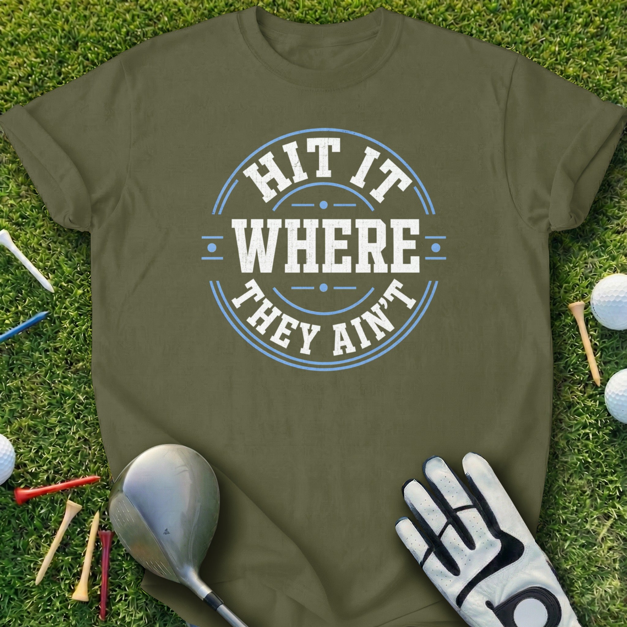 Green t-shirt with "HIT IT WHERE THEY AIN'T" in blue and white text.