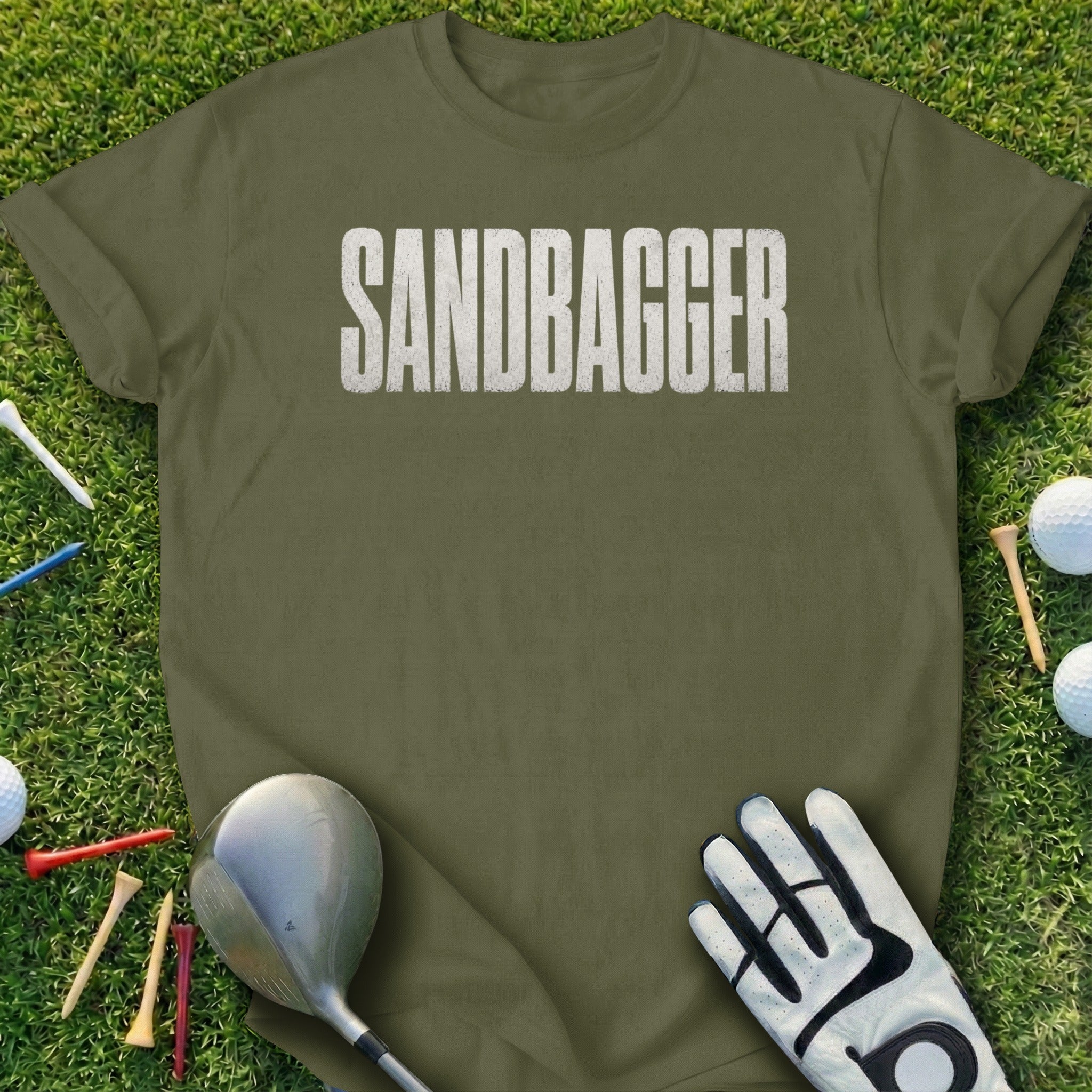 Olive t-shirt with "SANDBAGGER" printed in white text, with golf equipment.