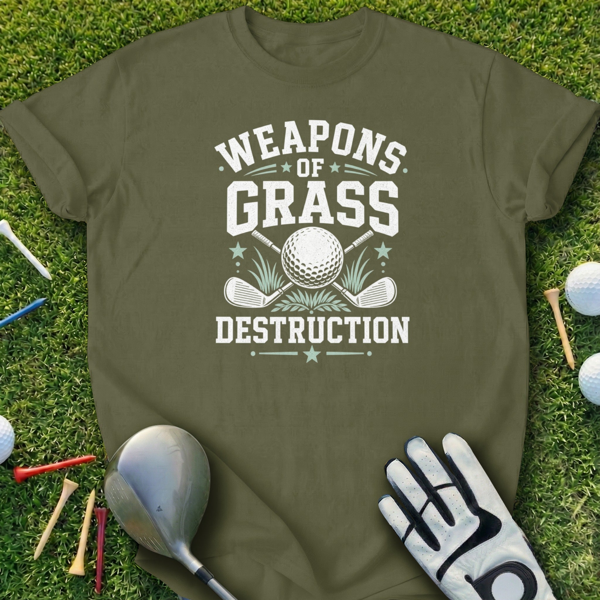 Green t-shirt with "Weapons of Grass Destruction" text, golf ball, and clubs.