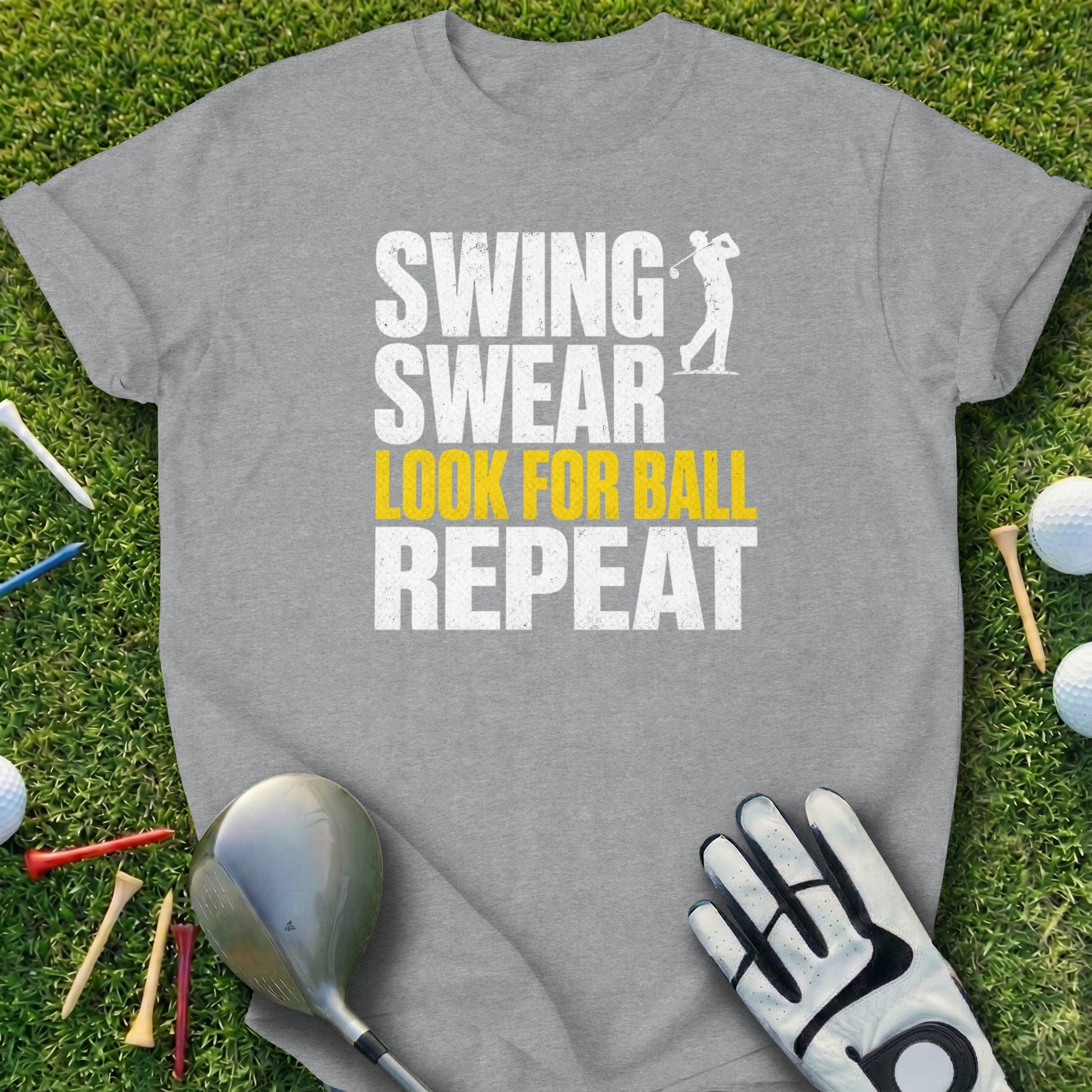 Gray t-shirt with "Swing Swear Look For Ball Repeat" text and golfer graphic.