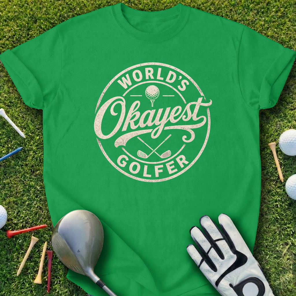 Green t-shirt with "World's Okayest Golfer" text and golf accessories.