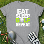 Grey t-shirt with "Eat Sleep Golf Repeat" text and golf accessories.