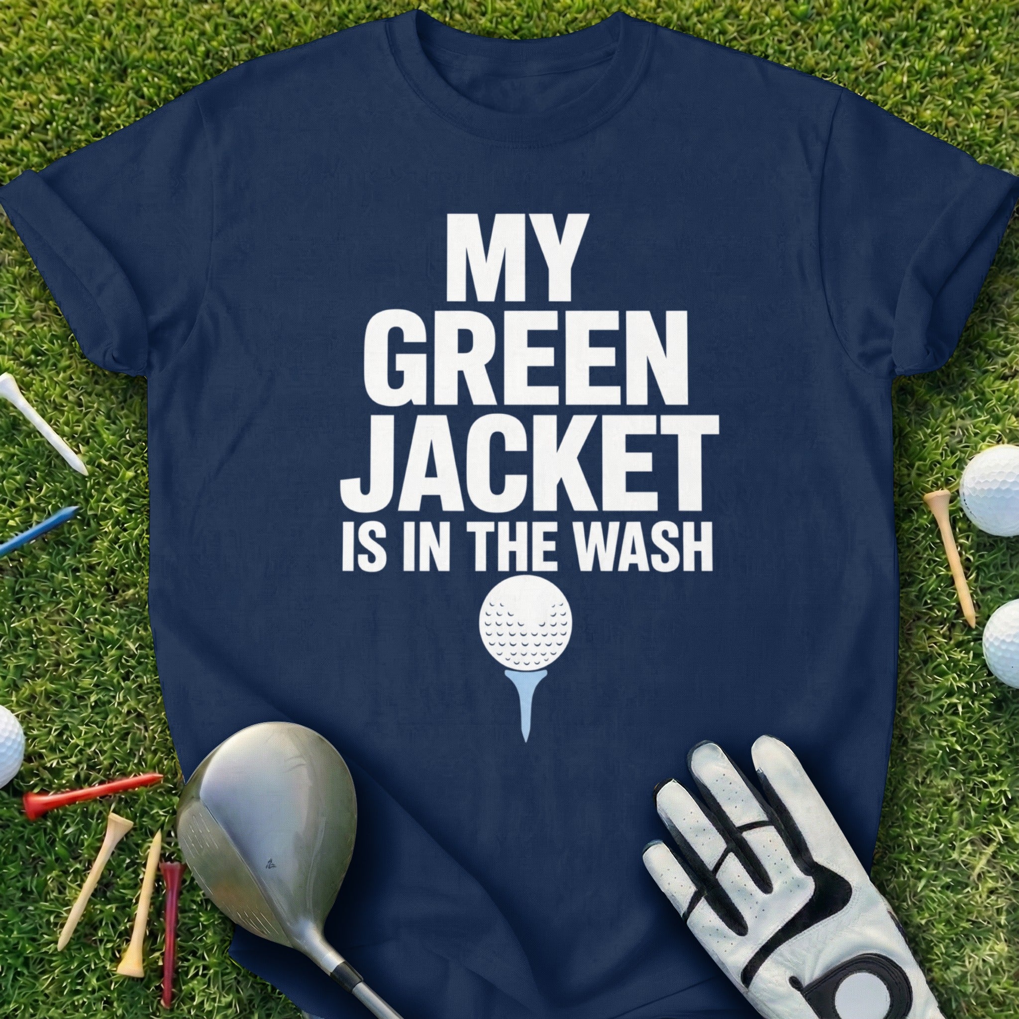 Navy t-shirt with white text "MY GREEN JACKET IS IN THE WASH" and golf imagery.