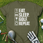 Olive green t-shirt with "EAT. SLEEP. GOLF. REPEAT." text.