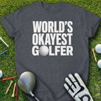Dark t-shirt with "World's Okayest Golfer" text and golf accessories.