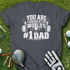 Dark grey t-shirt with "YOU ARE LOOKING AT THE WORLD'S #1 DAD" text and golf elements.