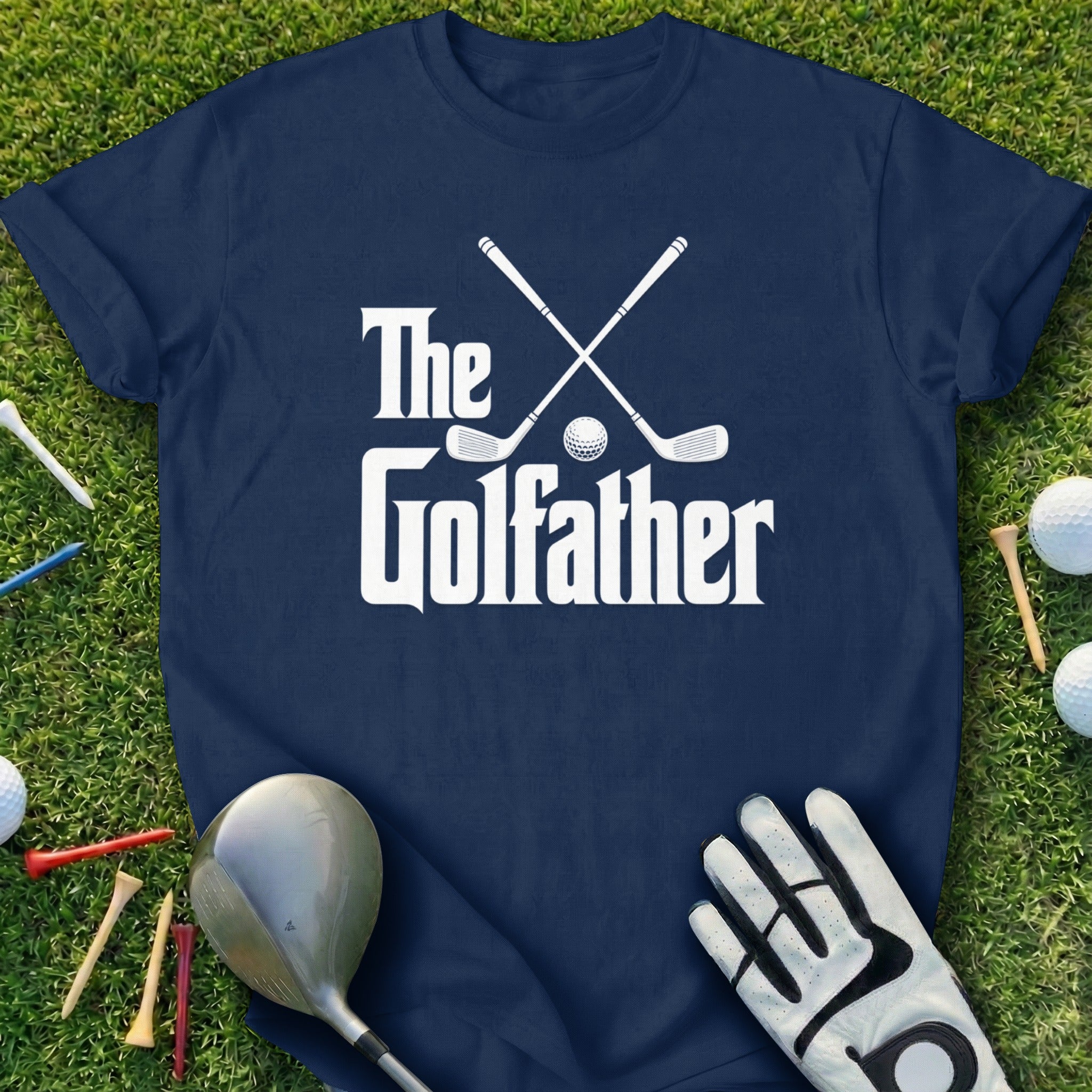 Navy t-shirt with "The Golfather" text and golf clubs, ball, tees, and glove.