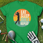 Green t-shirt with "Eat Sleep Golf Repeat" text and golfer graphic.