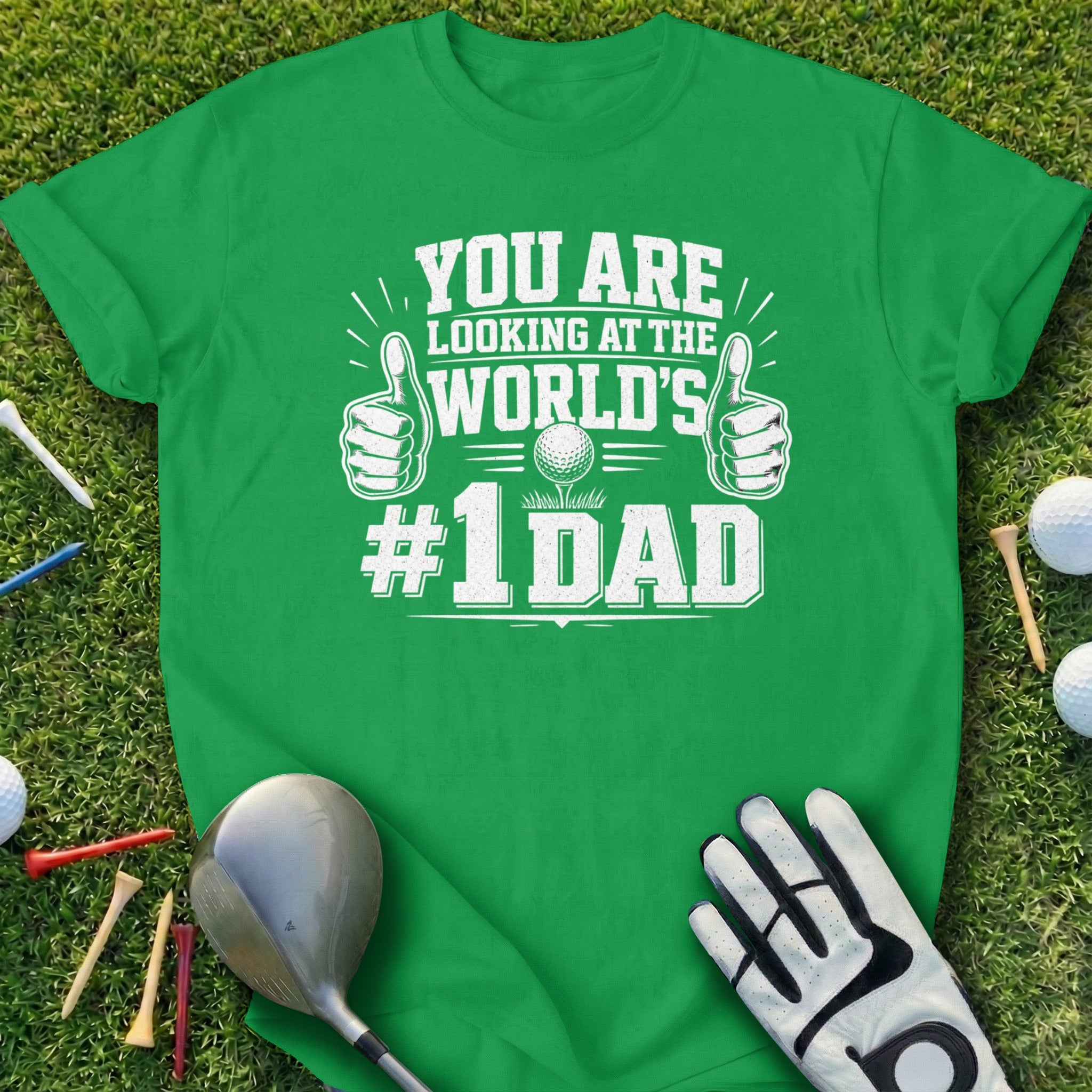 Green t-shirt with "YOU ARE LOOKING AT THE WORLD'S #1 DAD" text and golf imagery.