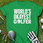 Green t-shirt with "WORLD'S OKAYEST GOLFER" in white text and a golf ball graphic.