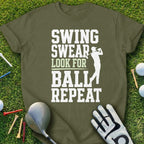 Golf t-shirt with "Swing Swear Look for Ball Repeat" text and golfer silhouette.